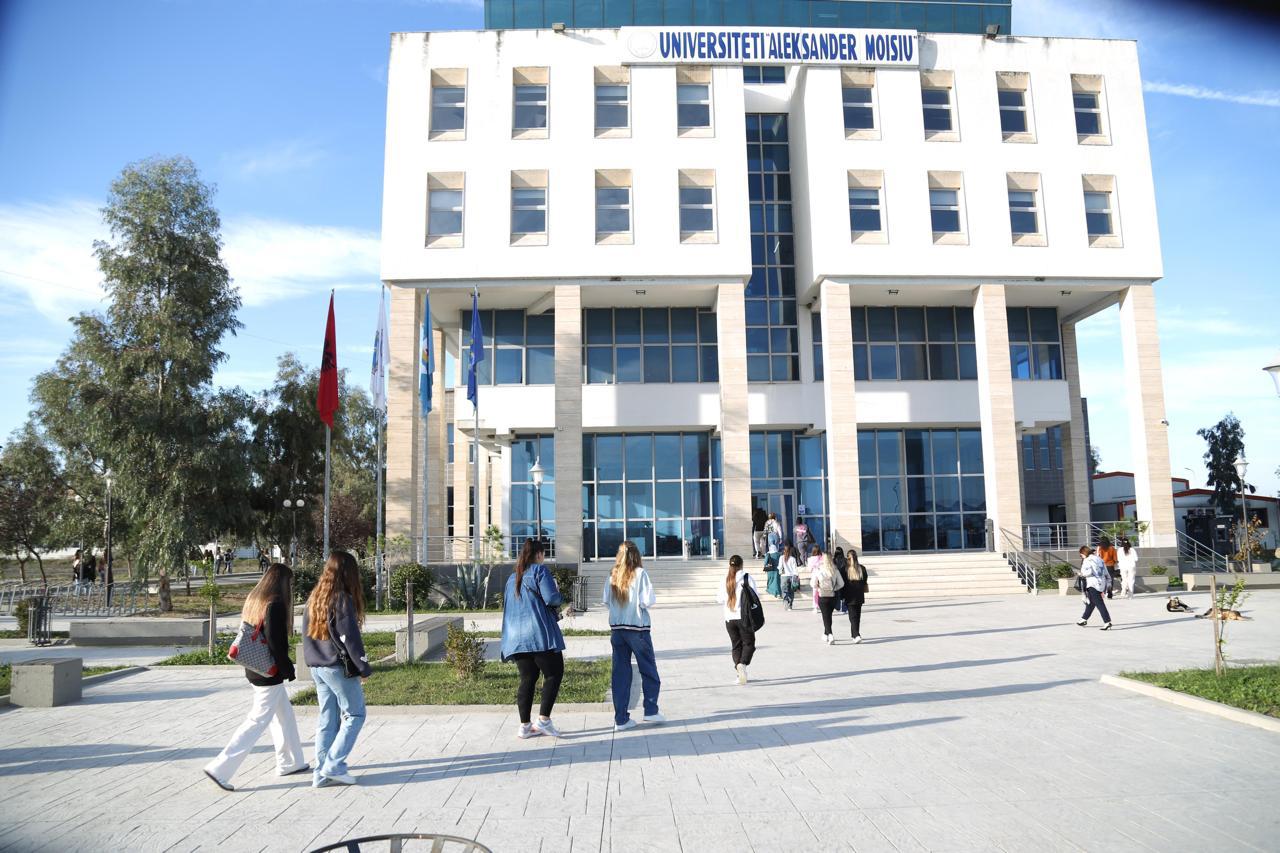 Professor and student at computer